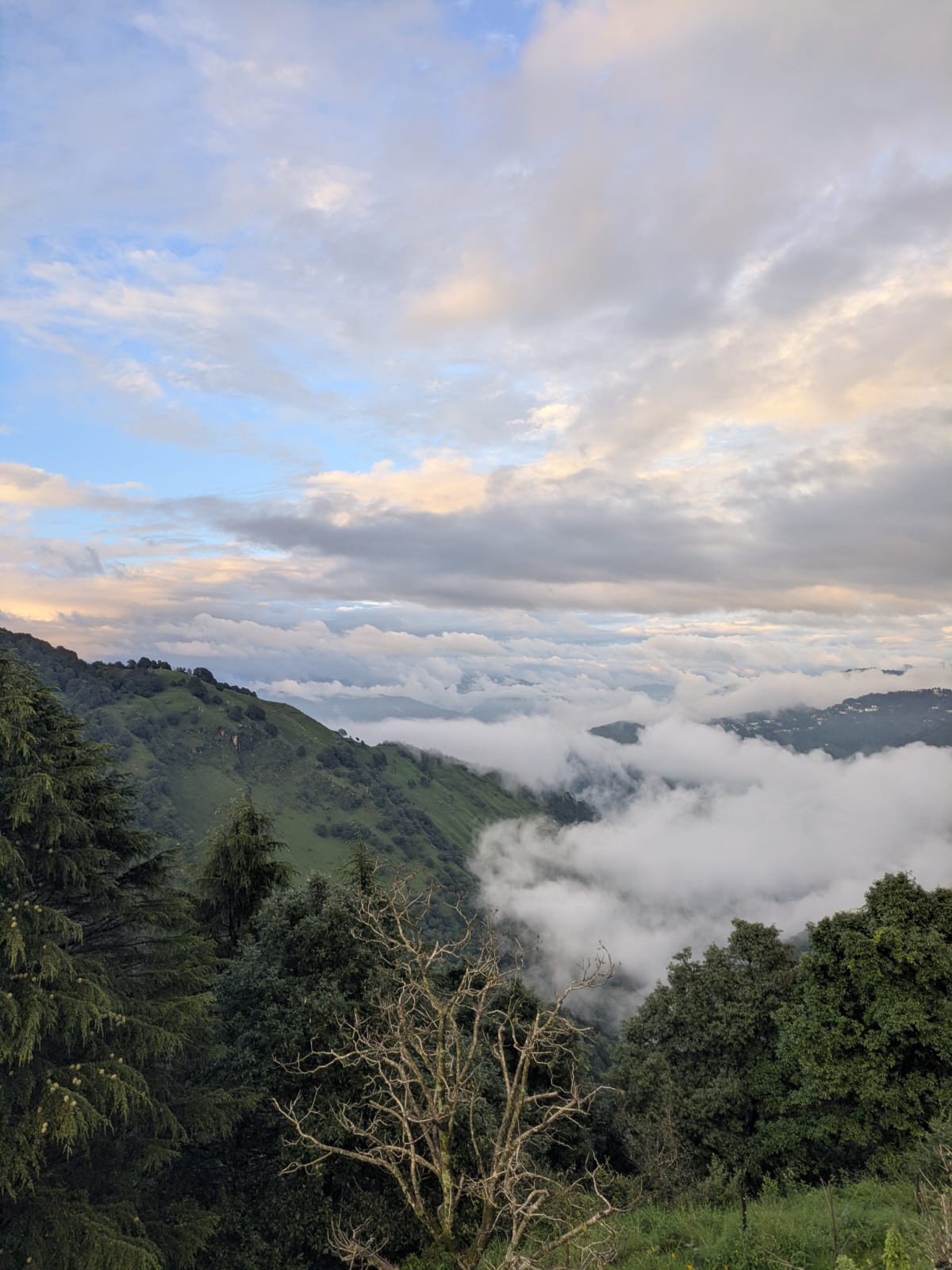 Clouds rolling over the valley at dusk
