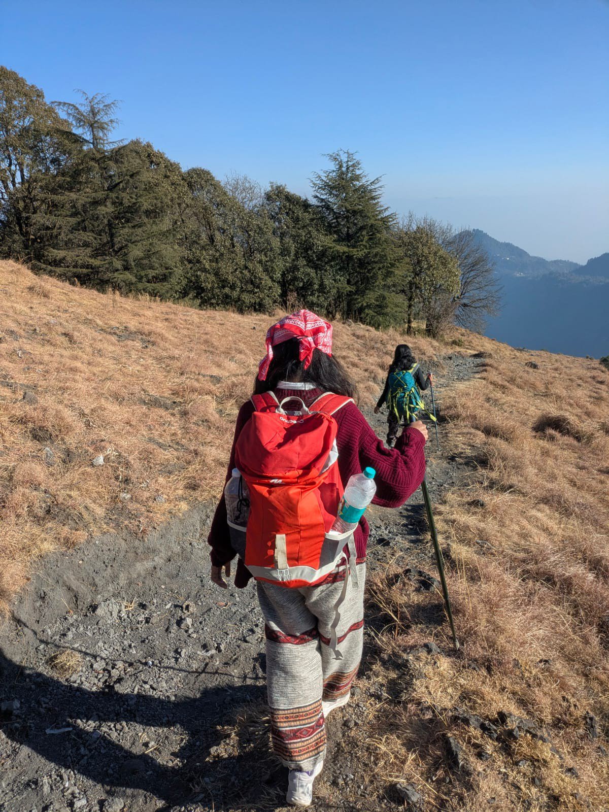 Trekker on a ridge with backpack